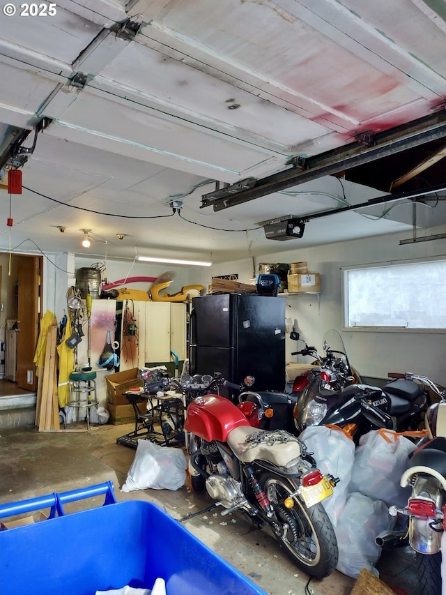 1218 SE 162nd Ave, Portland, OR 97233 - garage with freestanding refrigerator and a garage door opener