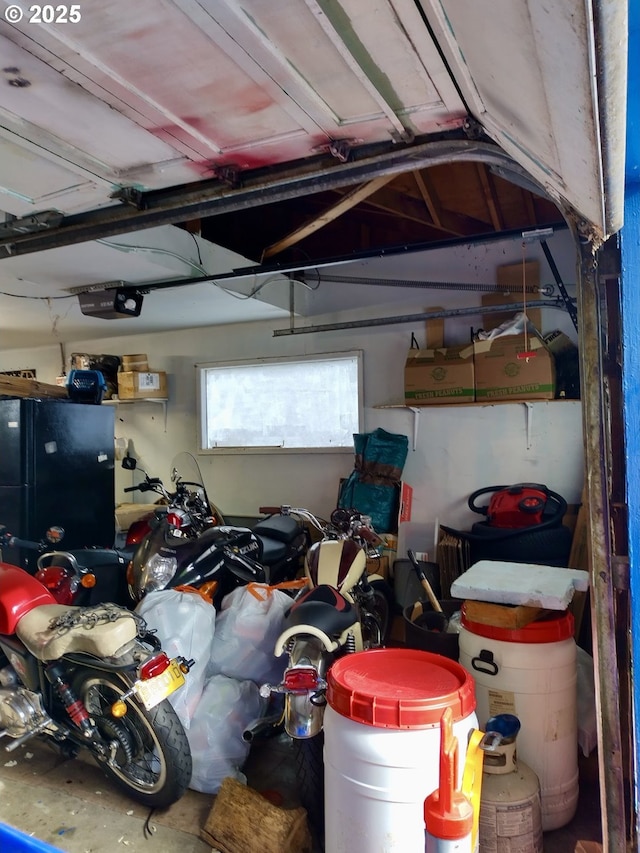 1218 SE 162nd Ave, Portland, OR 97233 - garage featuring freestanding refrigerator and a garage door opener