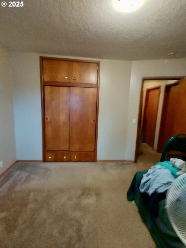 1218 SE 162nd Ave, Portland, OR 97233 - bedroom with a textured ceiling, light carpet, and baseboards