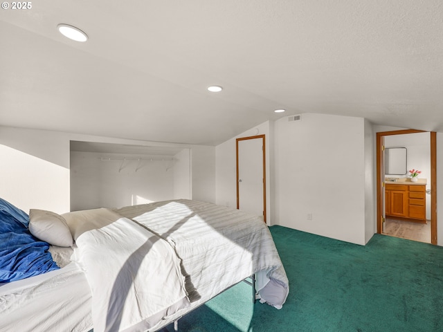 bedroom with recessed lighting, visible vents, vaulted ceiling, and light carpet