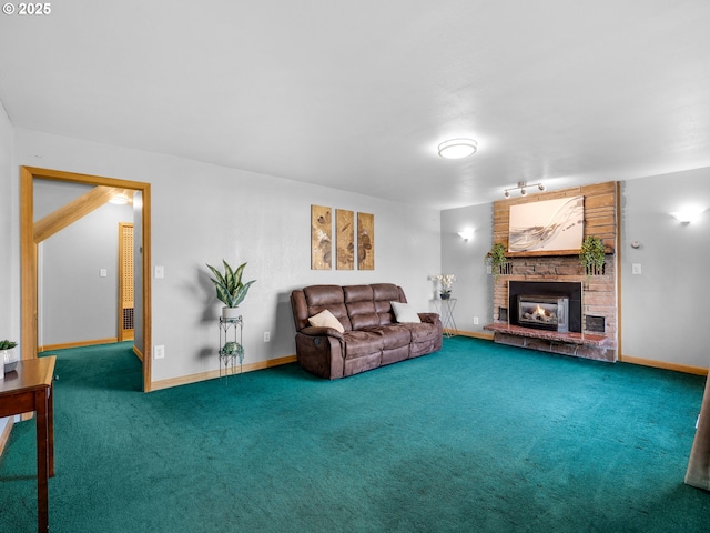 living room with carpet, a fireplace, and baseboards