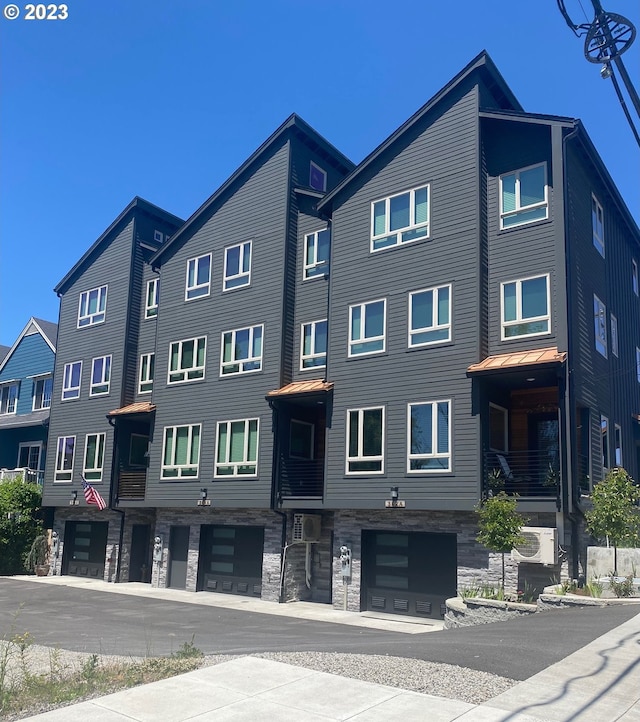 306 N Bridgeton Rd, Portland, OR 97217 - view of building exterior with a garage