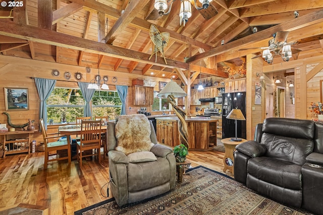 51256 Salmon Gulch Rd, Myrtle Point, OR 97458 - living area with wood walls, wooden ceiling, light wood-style flooring, ceiling fan, and a chandelier