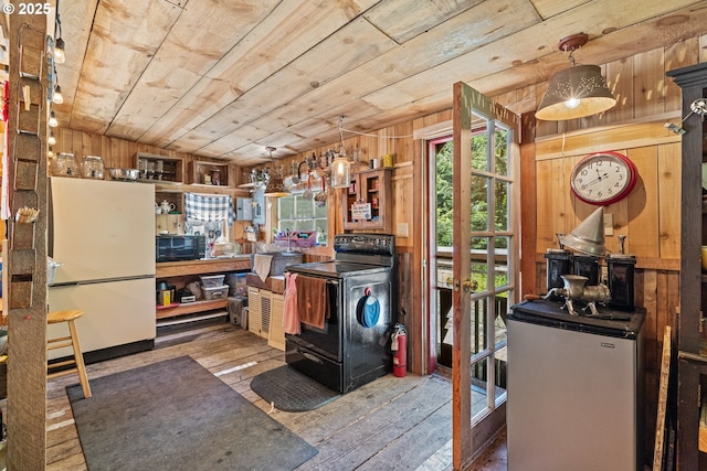 51256 Salmon Gulch Rd, Myrtle Point, OR 97458 - kitchen with black appliances, wooden walls, wood-type flooring, healthy amount of natural light, and wood ceiling