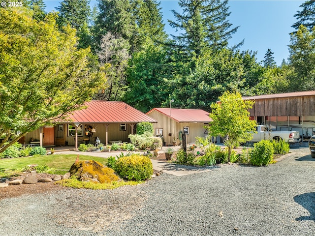 51256 Salmon Gulch Rd, Myrtle Point, OR 97458 - view of front facade featuring a porch and a metal roof