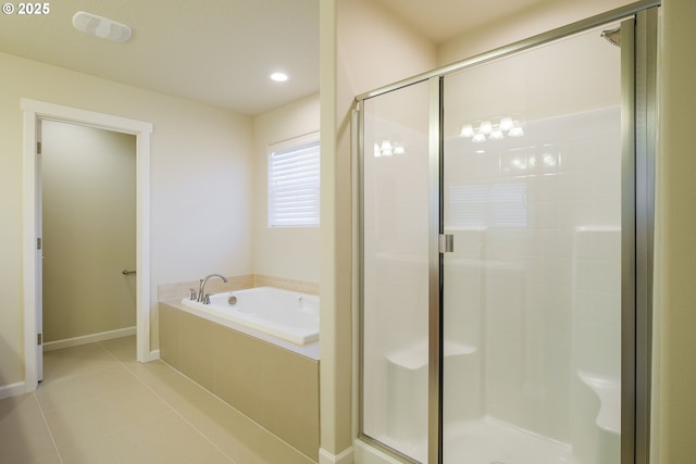 bathroom with tile patterned floors and separate shower and tub