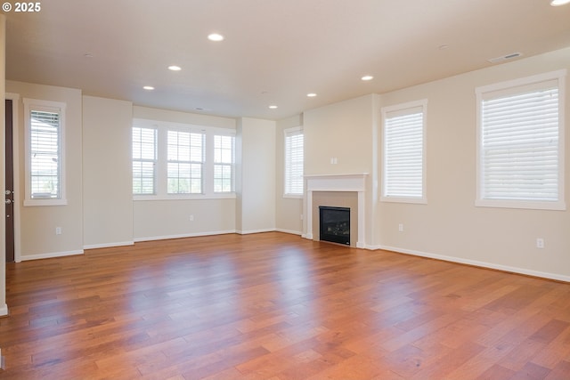 unfurnished living room featuring light hardwood / wood-style floors