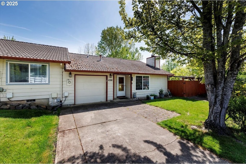 4590 SW 200th Ave, Beaverton, OR 97078 - ranch-style home featuring a front lawn, a garage, driveway, a chimney, and fence