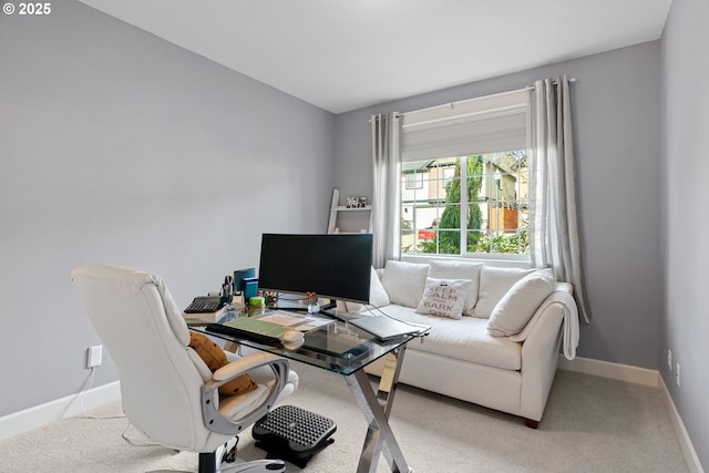 home office with light carpet and baseboards