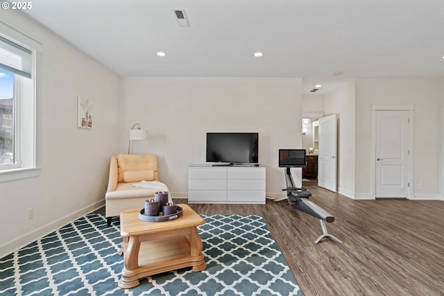 sitting room featuring recessed lighting, visible vents, baseboards, and wood finished floors