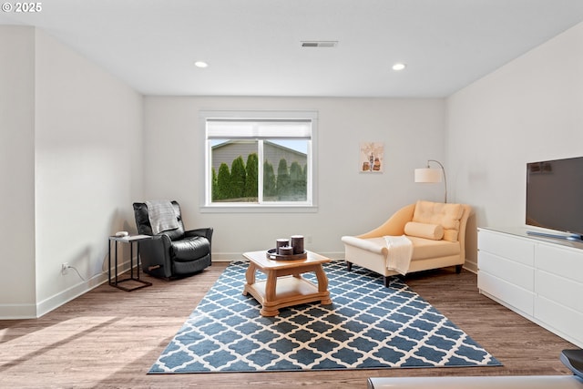 sitting room featuring recessed lighting, visible vents, baseboards, and wood finished floors