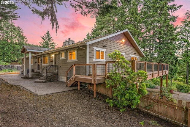 9595 SW Old Highway 47, Gaston, OR 97119 - view of front of property featuring a chimney, a patio area, and a wooden deck
