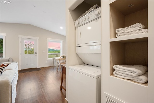 9595 SW Old Highway 47, Gaston, OR 97119 - laundry area featuring stacked washing machine and dryer, wood finished floors, baseboards, and recessed lighting