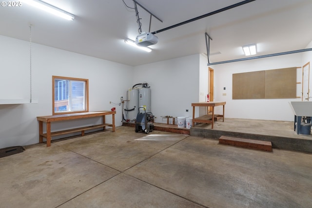 garage with a garage door opener and water heater