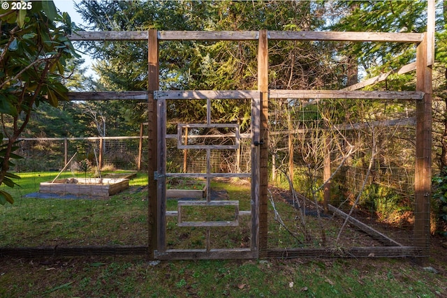 view of gate featuring a yard