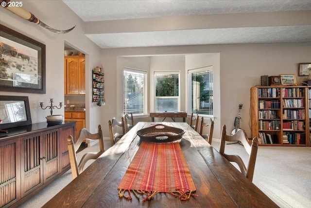 view of carpeted dining space