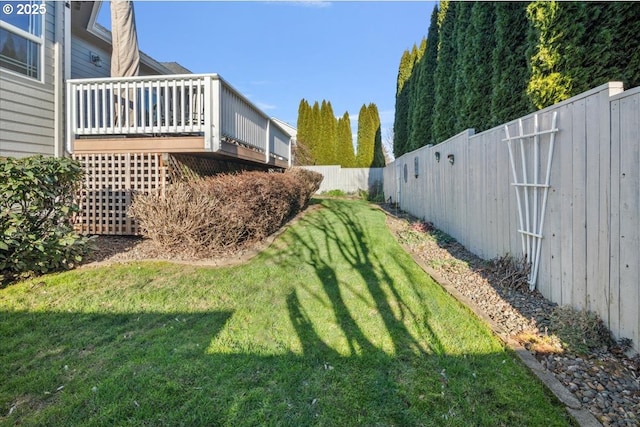 view of yard featuring a wooden deck