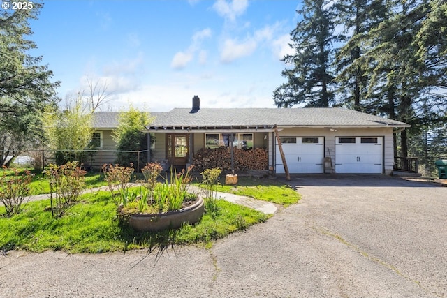 31958 J P W Rd, Scappoose, OR 97056 - ranch-style home featuring a garage, asphalt driveway, and a chimney