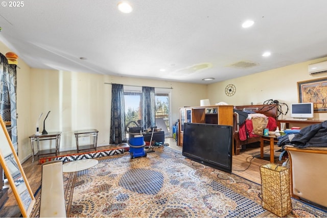31958 J P W Rd, Scappoose, OR 97056 - interior space with an AC wall unit, wood finished floors, and recessed lighting
