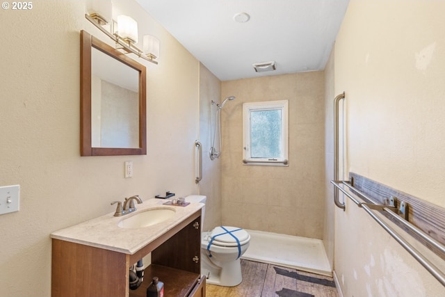 31958 J P W Rd, Scappoose, OR 97056 - full bathroom with toilet, a tile shower, vanity, and wood finished floors