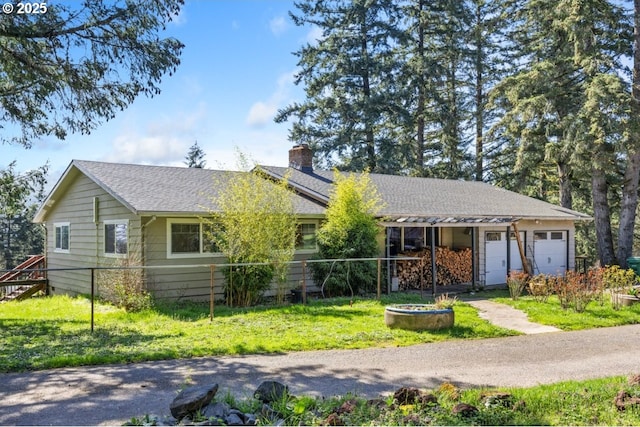 31958 J P W Rd, Scappoose, OR 97056 - single story home with a chimney, a front yard, and a garage