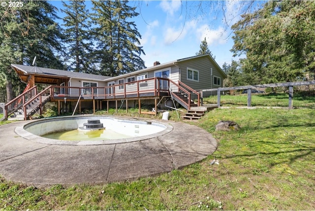 31958 J P W Rd, Scappoose, OR 97056 - back of property featuring stairway, a wooden deck, a chimney, and a yard