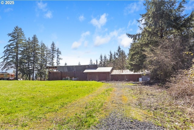 31958 J P W Rd, Scappoose, OR 97056 - view of grassy yard with driveway and an outbuilding
