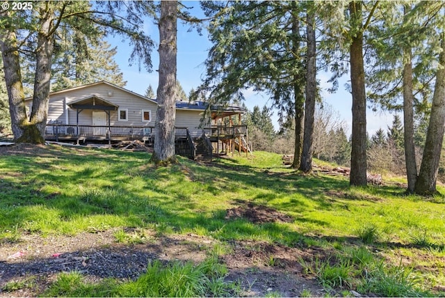 31958 J P W Rd, Scappoose, OR 97056 - view of green lawn featuring a deck and stairway