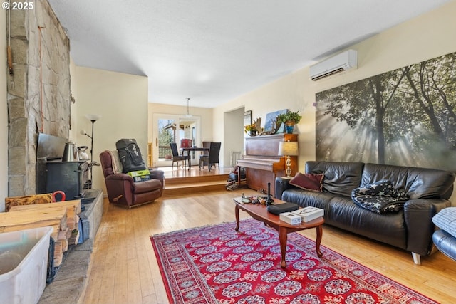 31958 J P W Rd, Scappoose, OR 97056 - living room with a wall mounted air conditioner and hardwood / wood-style floors
