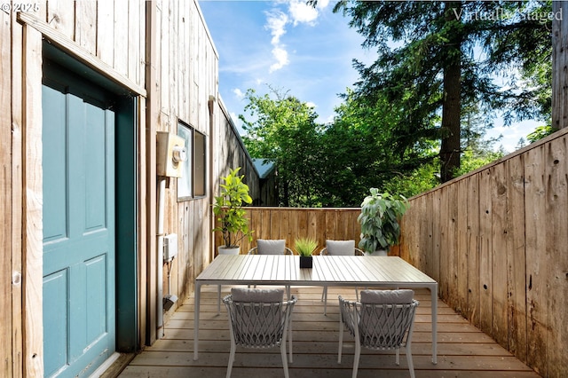 6438 SW Barnes Rd, Portland, OR 97221 - wooden terrace with outdoor dining area and a fenced backyard
