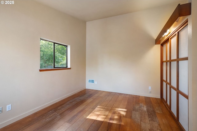6438 SW Barnes Rd, Portland, OR 97221 - empty room featuring hardwood / wood-style flooring and baseboards