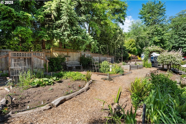6438 SW Barnes Rd, Portland, OR 97221 - view of yard with a garden and view of wooded area