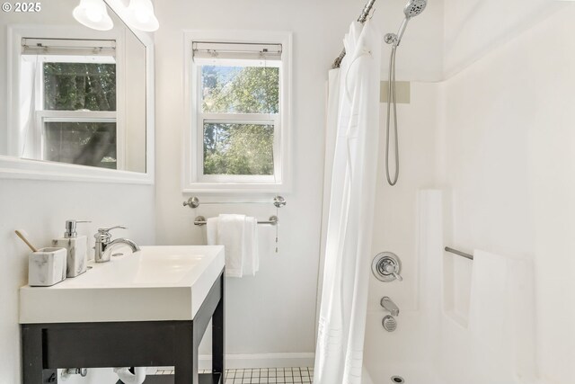 bathroom featuring baseboards and vanity