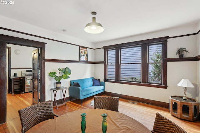 4121 N Albina Ave, Portland, OR 97217 - living room with baseboards and wood finished floors