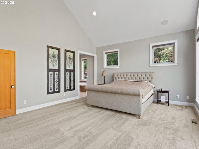 bedroom featuring multiple windows, carpet, baseboards, and high vaulted ceiling