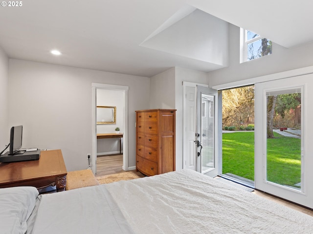 bedroom featuring wood finished floors, access to outside, recessed lighting, and ensuite bathroom