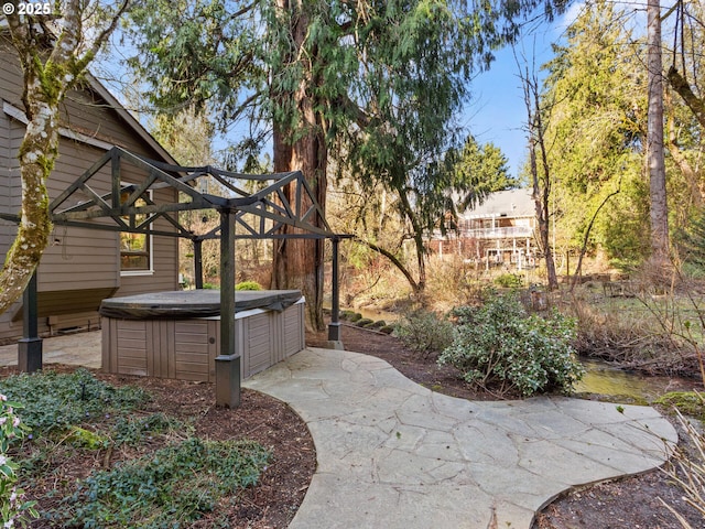 exterior space with a hot tub