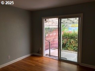7922 SW Capitol Hill Rd, Portland, OR 97219 - doorway with wood finished floors and baseboards
