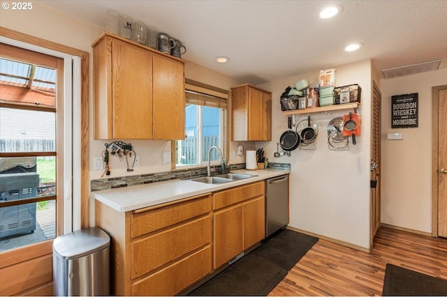 3977 SE Salquist Rd, Gresham, OR 97080 - kitchen featuring a sink, stainless steel dishwasher, light wood-style flooring, light countertops, and recessed lighting