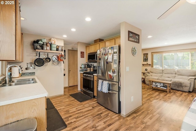 3977 SE Salquist Rd, Gresham, OR 97080 - kitchen with stainless steel appliances, a sink, light wood-style flooring, light brown cabinetry, and recessed lighting