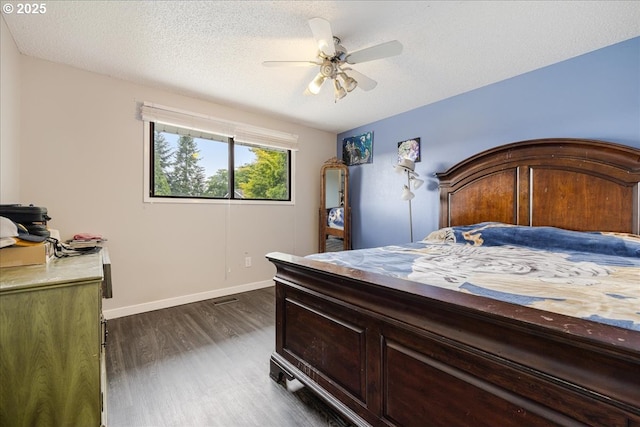12208 SE 38th Ave, Milwaukie, OR 97222 - bedroom with dark wood-style flooring, baseboards, ceiling fan, and a textured ceiling