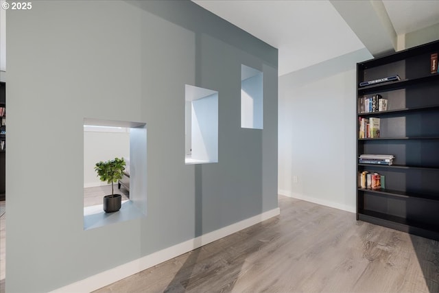 12208 SE 38th Ave, Milwaukie, OR 97222 - corridor featuring wood finished floors, baseboards, and built in shelves