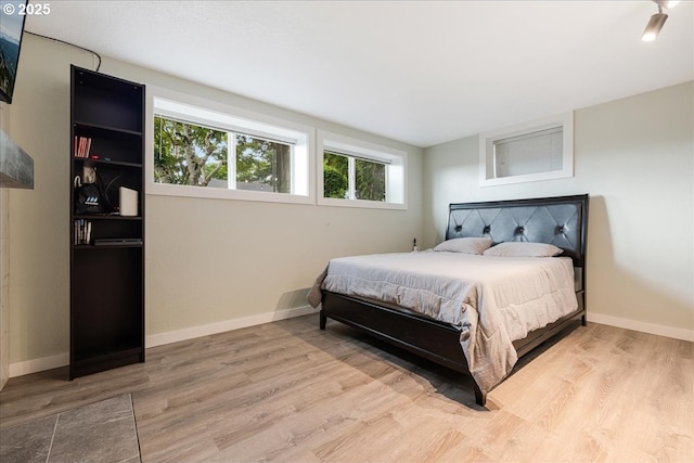 12208 SE 38th Ave, Milwaukie, OR 97222 - bedroom with wood finished floors, multiple windows, and baseboards