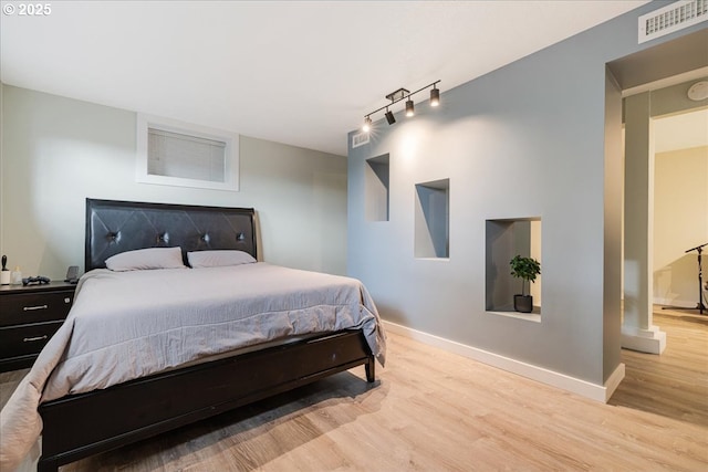 12208 SE 38th Ave, Milwaukie, OR 97222 - bedroom with wood finished floors, baseboards, and track lighting