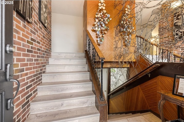 12208 SE 38th Ave, Milwaukie, OR 97222 - staircase featuring brick wall and tile patterned flooring