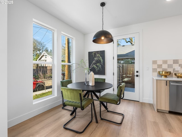 dining area featuring light wood-type flooring