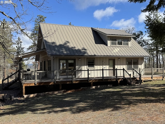 view of front of home with metal roof and board and batten siding