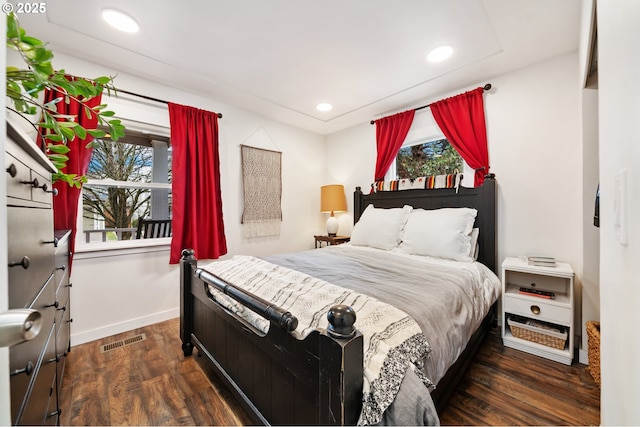 bedroom featuring recessed lighting, wood finished floors, visible vents, and baseboards