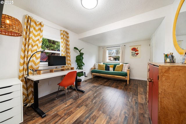 office featuring hardwood / wood-style flooring, baseboards, and a textured ceiling