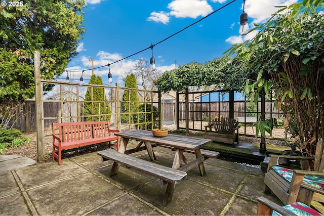 view of patio featuring a fenced backyard and outdoor dining space